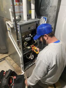 Technician checking furnace